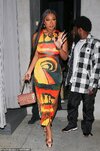 67763437-11759515-On_point_The_colorful_look_hugged_her_curves_and_featured_a_high-a-11_167657...jpg