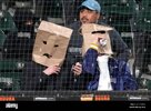 two-fans-wear-paper-bags-on-their-heads-during-the-eighth-inning-of-a-baseball-game-between-th...jpg