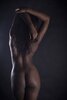 56403587-rear-view-of-sexy-nude-black-woman-over-black-background.jpg